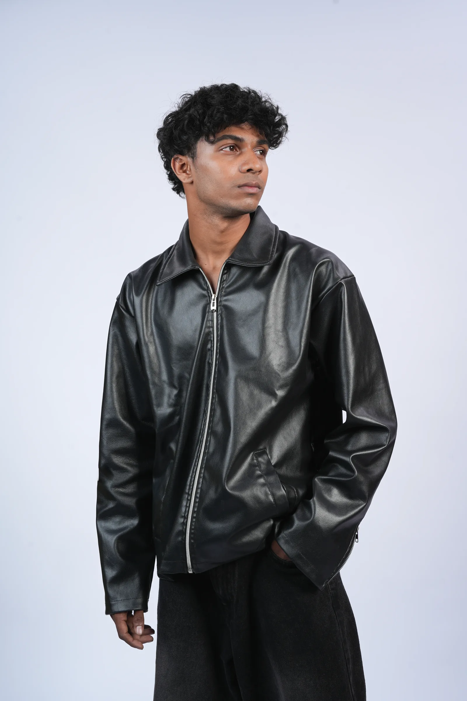 Studio headshot, leather jacket