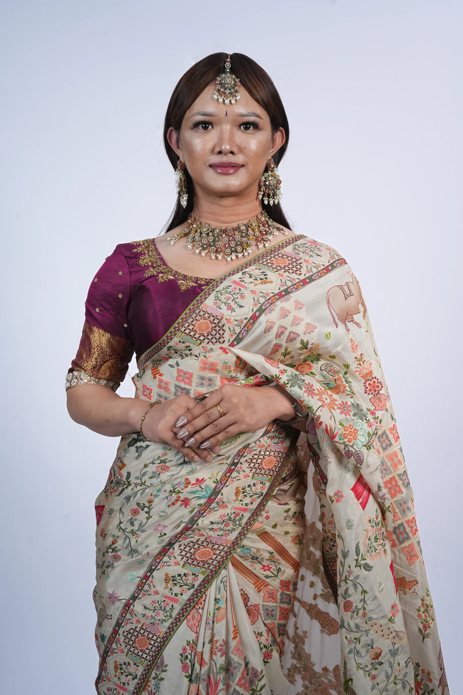 Studio portrait in bridal saree