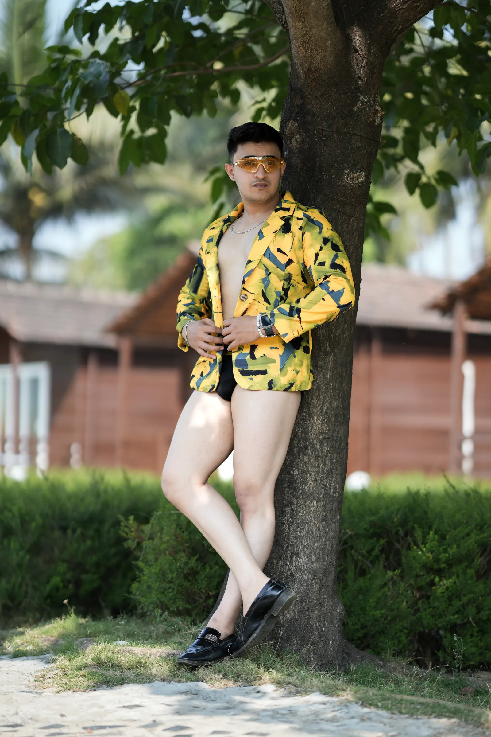 Model in yellow patterned jacket