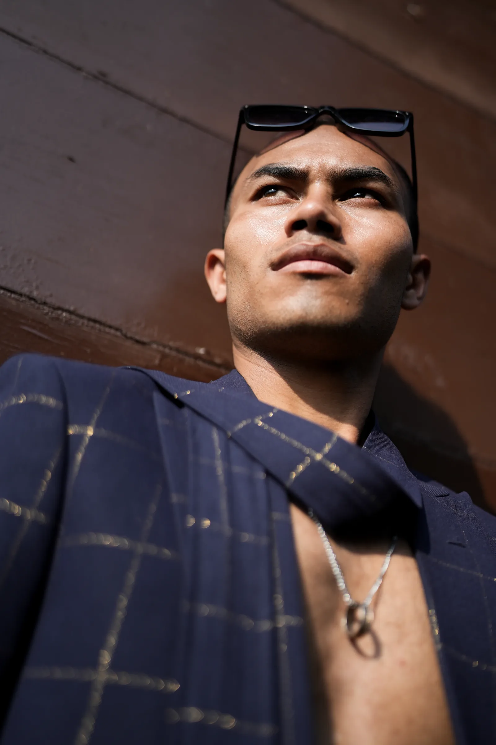 Low-angle editorial portrait in suit