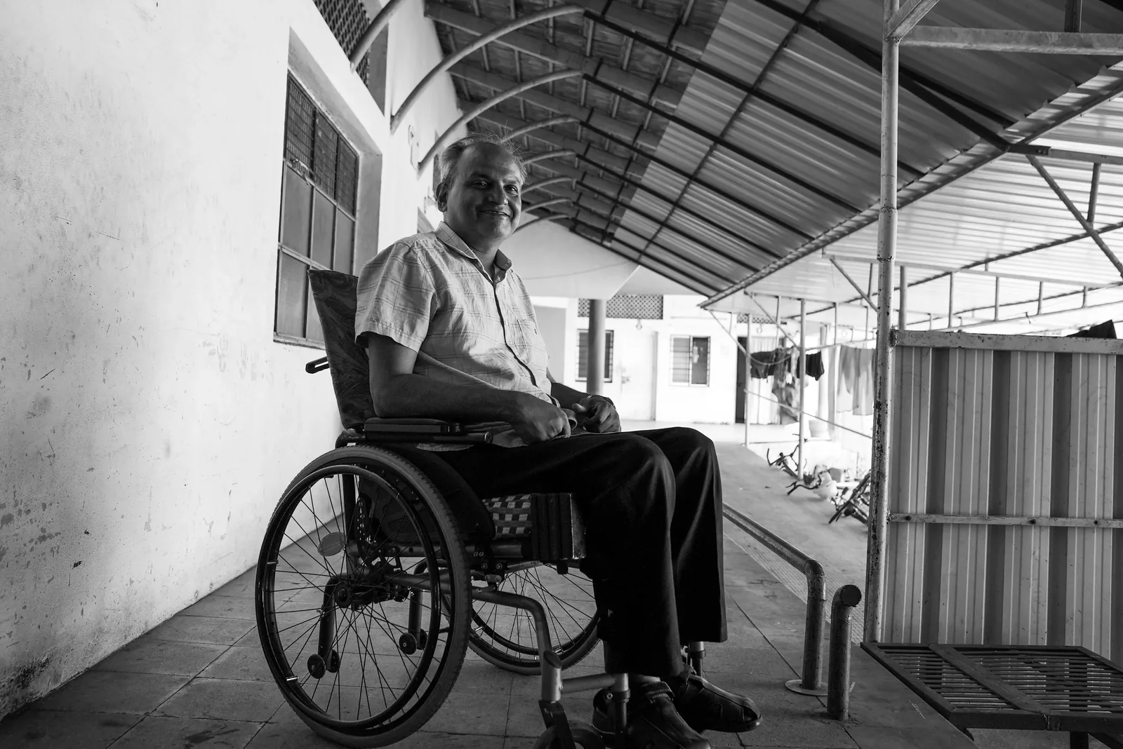 Man in a wheelchair, smiling